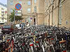 Bicycles parked in a busy city street
