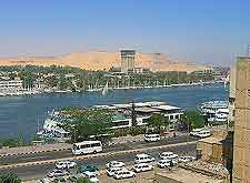 Image of buses and cars, travelling next to the Nile