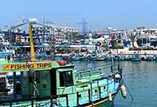 Image of fishing trip boat waiting for passengers on the harbourfront