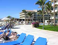 Image of sunloungers at beachfront resort