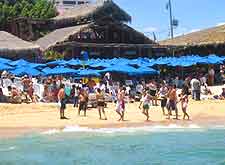 Photograph of beach-goers of the Medano Beach in Cabo San Lucas