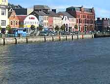 Photograph of the accommodation and buildings lining the River Lee