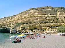 Photo of Matala beachfront and its unusual cave structures