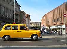 Photo of taxi cab in the city centre