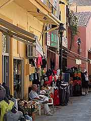 Image of diners eating outside in the sunshine