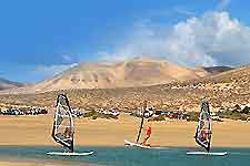 Photo of windsurfing along the coastline