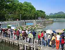 Photo of shoppers crossing the river