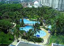 Photo of hotel complex and outdoor swimming pool