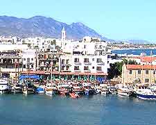 Photo of harbour, showing boats and waterfront restaurants