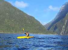 Image of kayaking alongside the mountains