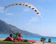 Photo showing paraglider taking off from the beachfront at Oludeniz