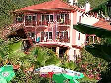 Summer picture of the accommodation provided by the Pink Palace
