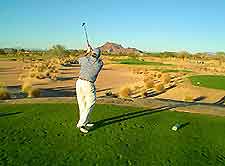 View of golfer playing a round nearby
