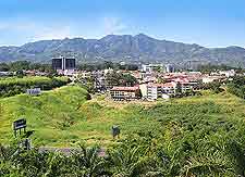 Cityscape photograph, with mountainous backdrop