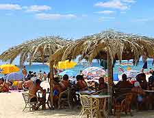 Further photograph of diners on Chia's beachfront