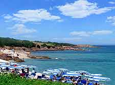 Image showing holiday makers sunbathing on La Marinedda Beach, northern Sardinia