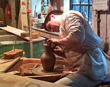 Image of working potter demonstrating at the Gladstone Pottery Museum