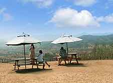 Picture of picnic tables overlooking the Piggs Peak area