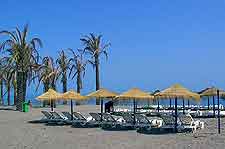 Photograph showing sun loungers on Playamar Beach