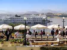 Photo of waterfront cafe tables, offering dining with a view