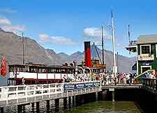 Additional cruise boat photo, showing mountainous backdrop